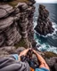 Placeholder: from the point of view of a rock climber, look down at the ocean rocks below as you climb high into the bluffs of ireland. holding on to the cliff face, the ocean below storms and swirls around a giant whirlpool IN THE RENAISSANCE STYLE