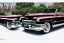 Placeholder: a true-to-life 1949 cadillac series 62 convertible, centered, intricate, extreme detailed, photorealism, center view, city background, pivot on cadillac, pen and color marker painting by cheryl kelley