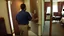 Placeholder: guy sniffs numbers on his hotel room door