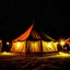 Placeholder: The tent was lit up under the stars.