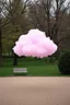 Placeholder: A pink plastic cloud floating in the park