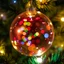 Placeholder: double exposure art of a colorful christmas night lit up with lights inside of a circular christmas ornament on a tree