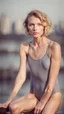 Placeholder: beautiful anorexic young woman, total shot, grey triathlon swimsuit, short blonde wavy bob hair, blurred city background