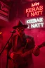 Placeholder: An spanish Guy with psychotic big eyes "Enrique" performing at dance club, his name is the stalker "Enrique" Red roses On stage, red Neon lights and smog, and "Din KEBAB I NATT" big sign on the wall, serenade under balcony, ZORRO vibes