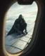 Placeholder: Bosch painting style ,nightmare, Scary hooded creature sitting on the wing of an airplane as seen from the airplane window