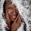 Placeholder: wonderfull african woman, curves, platinum long hair, hair covering one eye, ultradetailed fine art photo of a african , weet face portrait, snow flakes particles, 35 mm