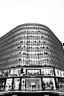 Placeholder: frontal view, black and white outline of modern, 30 story shopping mall