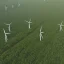 Placeholder: Aerial Drone Footage of Wind Turbines in Rural Area with Green Forests and Fields