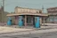 Placeholder: gas station, boarded, post-apocalypse, front view, street, comic book, cartoon