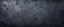 Placeholder: Black navy blue texture background with space for design. Dark rough concrete wall surface. Close-up. Web banner. Wide. Panoramic.