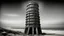 Placeholder: A black and white photograph captures a surreal scene on a beach, dominated by a tall, cylindrical structure reminiscent of a tower, leaning at a precarious angle. The tower is made of a rough, textured material, possibly concrete or stone, and is punctuated by numerous rectangular openings that appear to be windows. A figure is suspended from the tower by a rope, adding a sense of scale and drama to the composition. The person is a 25 year old man. The beach itself is sandy, with visible wind-s