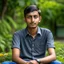 Placeholder: an 24 year old indian man, oval face, tanned skin, wearing shirt and jeans, sitting in a garden, peaceful, front face portrait, short hair