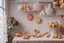 Placeholder: amigurumi desserts, cookies and macarons on lace tablecloth in a modern kitchen in sunshine