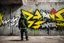 Placeholder: a graffiti painted on concrete wall of underpass: a graffiti (portrait:1.6) of a young cyberpunk hacker with graffiti text in white all-caps text: "WINTERMUTE"; street art, graffiti green-yellow-black triotone, wall painted matte black and yellow and deep red, semi-front view, low angle, daylight, cinematic, dramatic