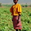 Placeholder: Girl with amazing Ethiopian clothes in farming area