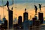 Placeholder: tightrope walkers over rooftop chase at brutalist tower, dark arachnid monster shadows jumping from roof to roof by by Étienne-Jules Marey & Catherine Jeffrey Jones, vibrant colors, dramatic, contrasting sillouhettes, skyline in the back, technological antennae towers, telephone wires and poles, cranes