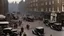 Placeholder: 1940s London street with bomb damage, injured people, vehicles, ambulances, fire engines, wartime, full colour