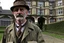 Placeholder: ww1 doctor talking close-up standing up looking to the camera, ww1 mansion infirmary background