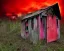 Placeholder: The entrance to Hell crossed with Alice in Wonderland, red clouds, abandoned shack, Cheshire cat