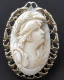 Placeholder: beautiful decorative cameo brooch with a spirit bear, decorative design, classical ornament, bilateral symmetry, highly detailed etching, marble carving