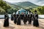 Placeholder: a group of men standing next to each other in Azerbaijan costume , female dancer, softair arena landscape, made in 2019, black cylindrical hat, olympics ceremony, islamic interior design, exhibition display, panorama shot, Siona Shimshi, woodlands style, 2019, caravagio, general uniform, ymmetrical