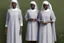 Placeholder: 4 suore africane con tunica grigia figura intera