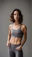 Placeholder: photography of a beautiful anorexic woman, grey satin triathlon top, sports illustrated, brunette short wavy bob haircut, pronounced sternum, flat chest, anthracite short leggins