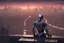 Placeholder: Humanoid looking robot looking out over an alien town skyline at dusk