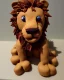 Placeholder: Lion simba model made of chocolate cake with digestives