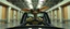 Placeholder: car driving happy 2d insect anime fluffy slimy alien okapi gremlin man in the style of Escher and Giger and Fallout 4, pinhole cam, airbrush 3d rendering, on tv screen:A five-second cinematic single take in a clean industrial presentation hall.