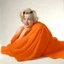 Placeholder: A photograph of young marilyn monroe inthe style of milton greene, orange blanket, white background