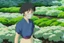 Placeholder: A young woman, Yui, is seen inside one of the biodomes tending to a variety of plant life. Her eyes reflect determination and spirit. She wears a respirator around her neck,