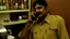 Placeholder: indian hotel keeper drools while drunk on the phone