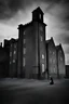 Placeholder: An historical photograph of a building of a grimy asylum in Ireland in black and white, with a lot of sky showing and eerie atmosphere and a nun