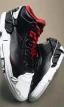 Placeholder: Jordan 3 black sneaker. Inside red fires.