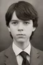 Placeholder: 1920's yearbook photo, teenage Carl Grimes (Chandler Riggs) 14 years old, brown hair, 1920's hairstyle and clothes, photorealistic, --ar 9:16 --style raw