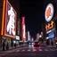 Placeholder: advertisings on giant signs in an unknown script, nstreet, made of cake-frosting and felt, volumetric light, hypermaximalist, night, nightmare, fun, 3d, odd logo, persone, auto, chaos