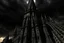 Placeholder: A twisted, dark, cathedral/tower stretching into a cracked sky