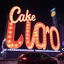 Placeholder: Giant advertisings on giant signs in an odd script, made of cake-frosting and felt, volumetric light, hypermaximalist, night, nightmare, fun, 3d, odd logo, persone, auto, chaos