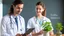 Placeholder: male and female doctor with stethoscope looking at herbal plant and smiling