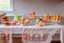 Placeholder: amigurumi desserts, cookies and macarons on lace tablecloth in a modern kitchen in sunshine