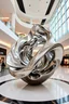 Placeholder: "An indoor mall sculpture featuring polished metallic fractal waves, reflecting light, creating a modern and infinite design."