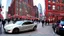 Placeholder: A Tesla's 'Model S Plaid' is racing at top speed, on the South Street Seaport, in New York. CINEMATIC. WIDE ANGLE LENS. PHOTO REAL.