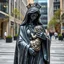Placeholder: photo of a lady statue made of black marbel showing a goddoss love mother and baby in a modern city center
