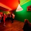 Placeholder: Party, cheering people, Austrian aesthetic, warm colors, wooden floor, green walls, red, chiaroscuro, 8k, HD, cinematography, photorealistic, Cinematic, Color Grading, Ultra-Wide Angle, Depth of Field, hyper-detailed, beautifully color-coded, insane details, intricate details, beautifully color graded, Cinematic, Color Grading, Editorial Photography, Depth of Field, DOF, Tilt Blur, White Balance, 32k, Super-Resolution, Megapixel, ProPhoto RGB, VR, Halfrear Lighting, Backlight