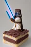 Placeholder: sponge cake filled with chocolate topped with a marzipan Jedi holding a lightsaber