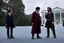 Placeholder: realistic young Harry Potter talking to Rubeus hagrid in front of white house