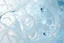 Placeholder: A soft, dreamy generative-art scene featuring complex hypnotic fractal structures evolving through fluid organic and geometric forms. Smooth translucent iridescent glass surfaces contain internal light and delicate bubbles, set agai