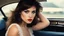 Placeholder: [artistic photo by Tony Kent (1980)] a brunette in a car bends over to look at the camera, she is going to a party, she has a cigarette