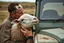 Placeholder: a portrait of a broken head mechanic, kissing a hybrid mixed body part sheep, fixing (far away old land rover 4x4 discovery 2) in the countryside